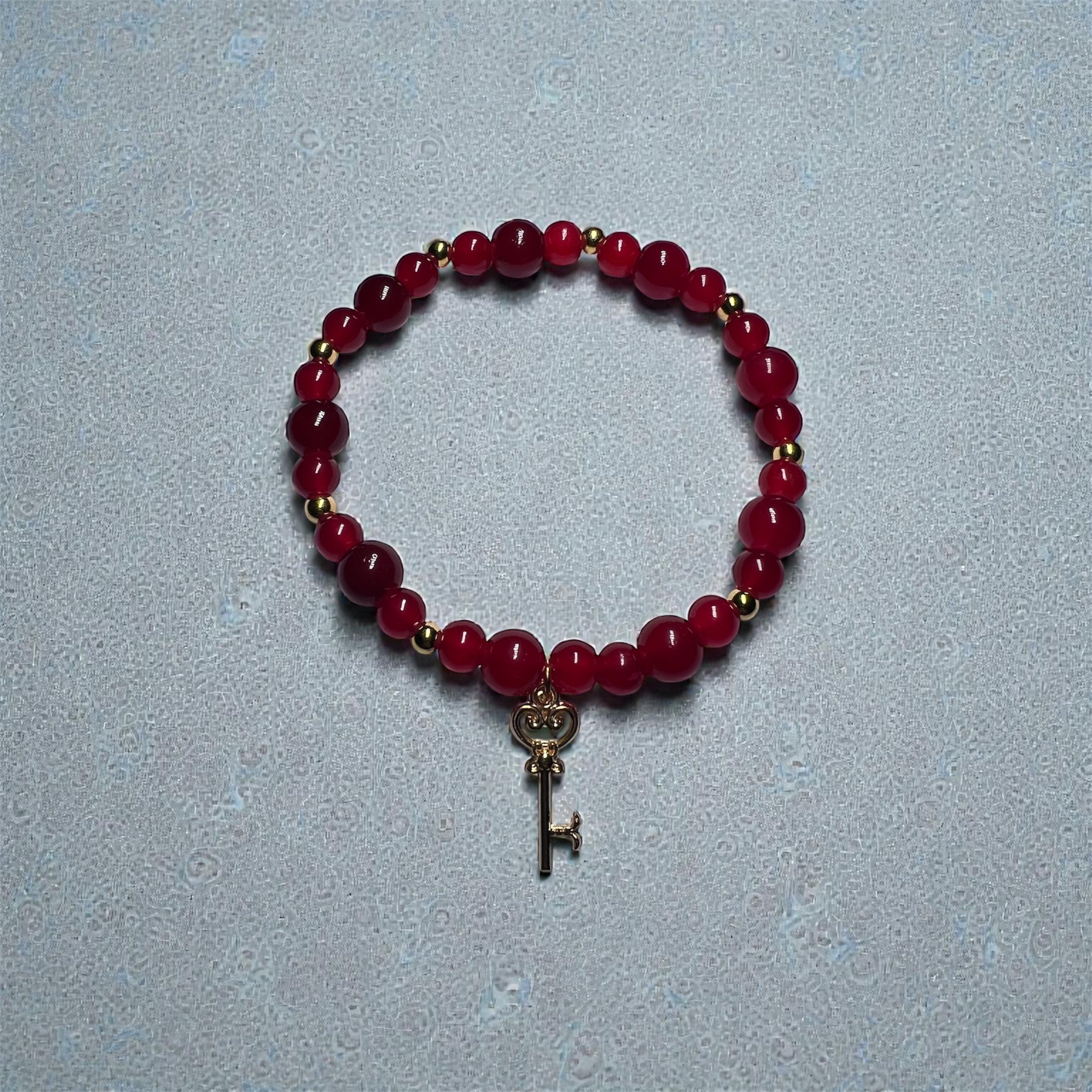 Red glass beads with key charm